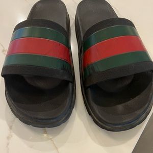 Mens Gucci slides.